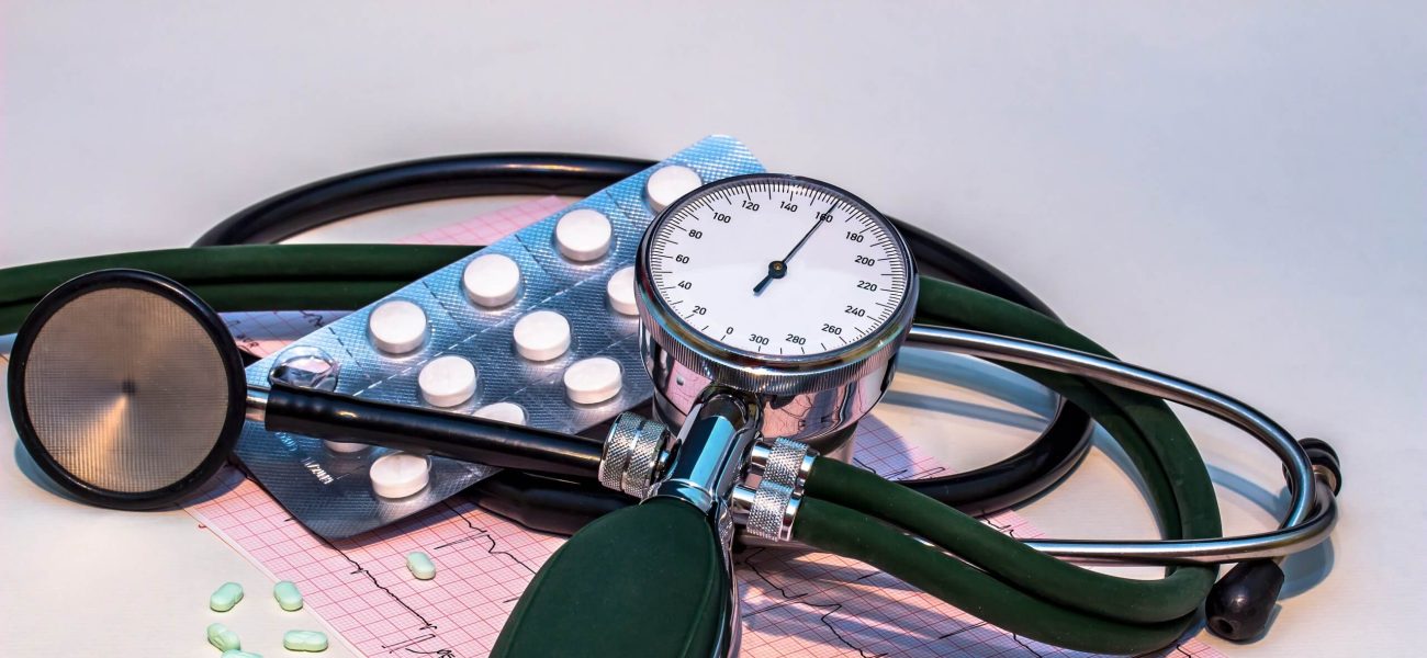An electrocardiogram, stethoscope and medication associated with high blood pressure