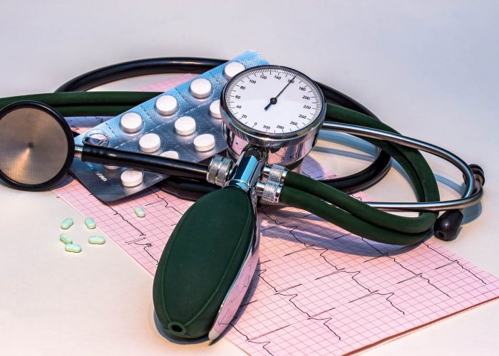 An electrocardiogram, stethoscope and medication associated with high blood pressure